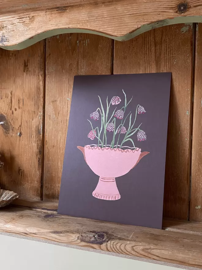 print with fritillaria also known as snakes head flowers in a pink vase.