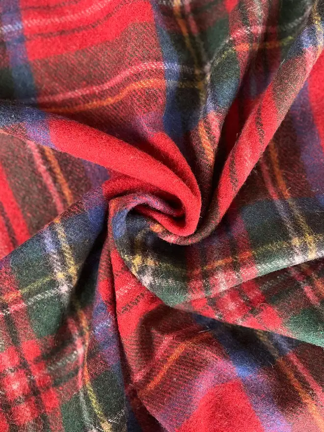 Royal Stewart Blanket, a curled red blanket. 