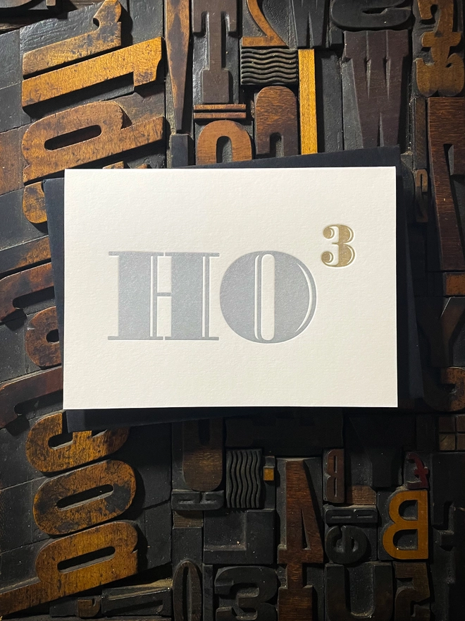 Ho Ho Ho! A beautiful typographic letterpress Christmas card. Printed in rich metallic silver and gold inks with luxury matching and contrasting envelopes; ideal to send to your designer friends at the festive season.