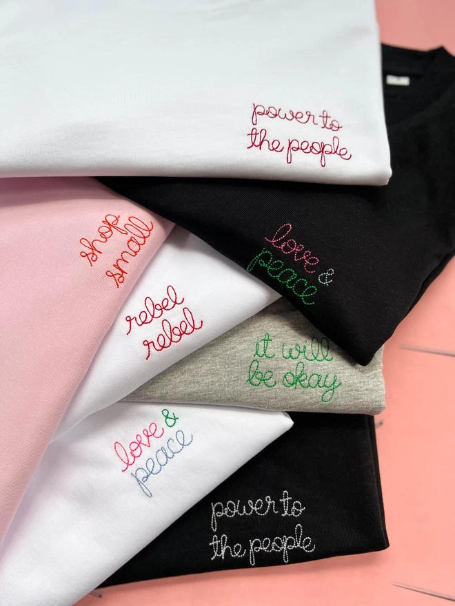 A flatly of colourful embroidered T-shirts