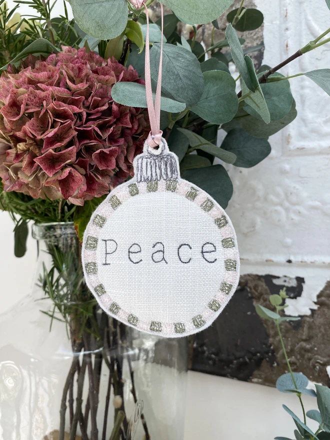 Peace Embroidered Square Edge Detail Bauble in flowers in vase