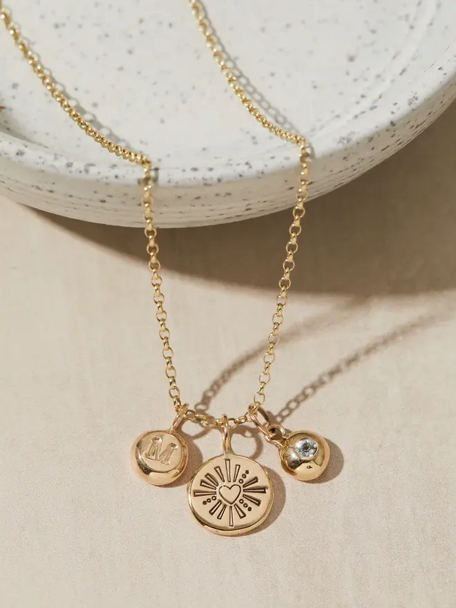 9ct Gold Darling Heart Pebble Necklace with a birthstone charm and a letter charm