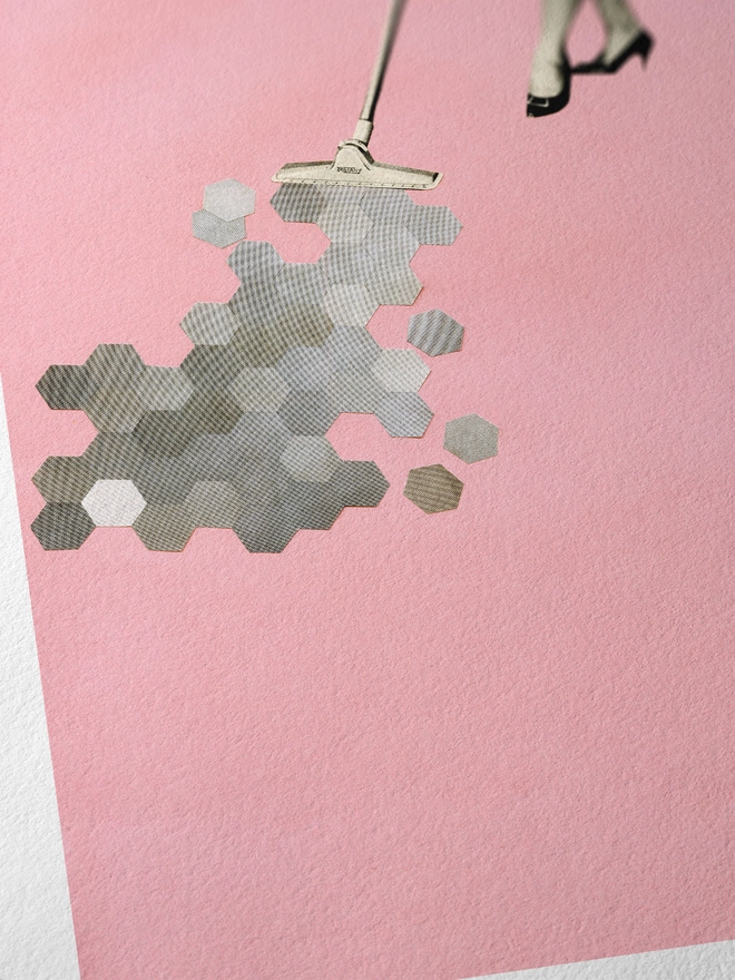 A retro print featuring a woman hoovering up geometric shapes.