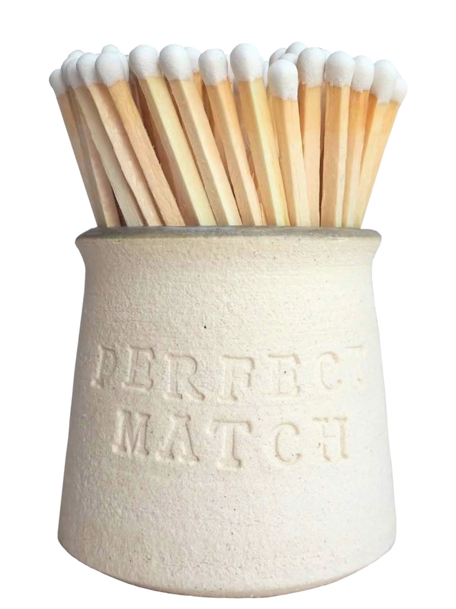 Match Pot containing white tip matches. Perfect match on the outside, white background