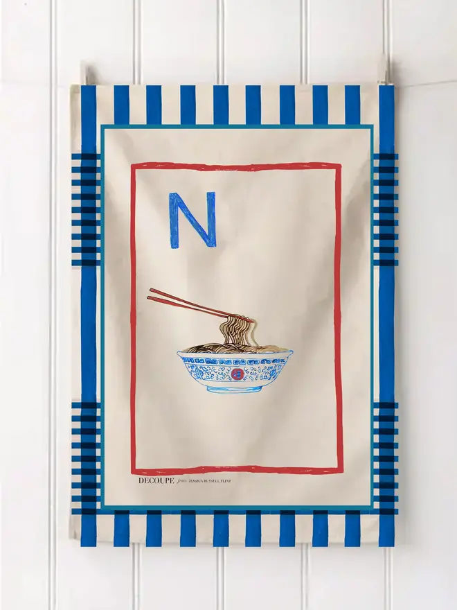 a-z alphabet tea towel. a tea towel with a noodles print and the letter 'n' in the corner.