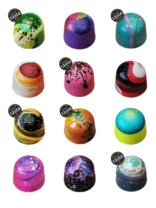 selection of 12 chocolate bon bons in different brightly coloured designs