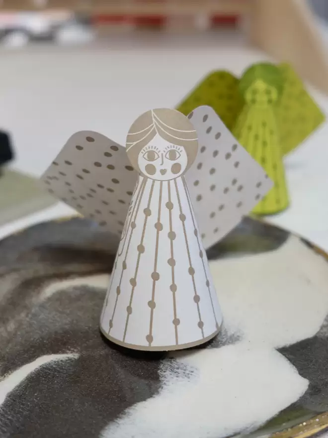 Gold, illustrative angel card - 3D pop-out card standing on dish.