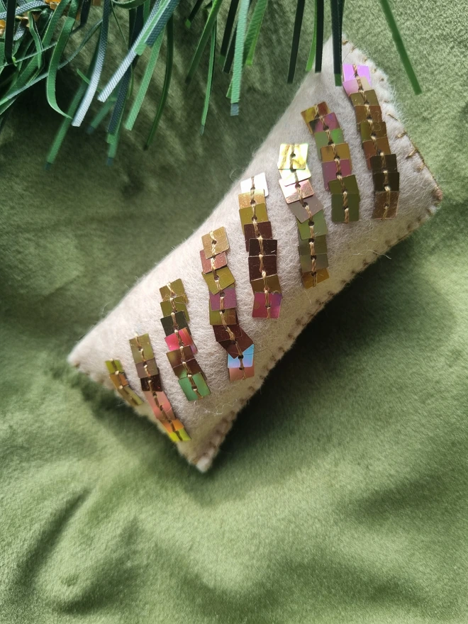 The embroidered sausage roll ornament