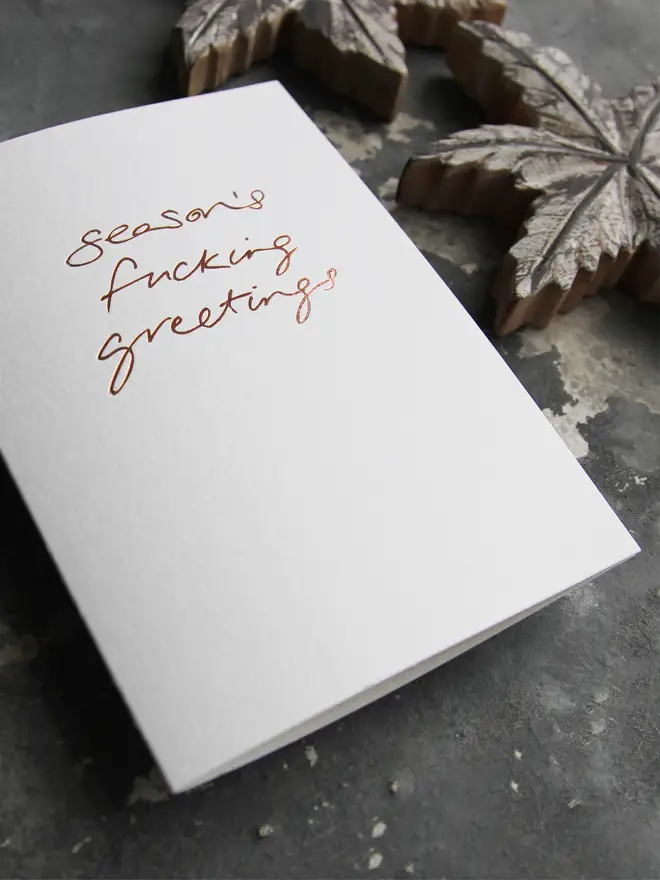 seasons greetings white christmas card metallic script