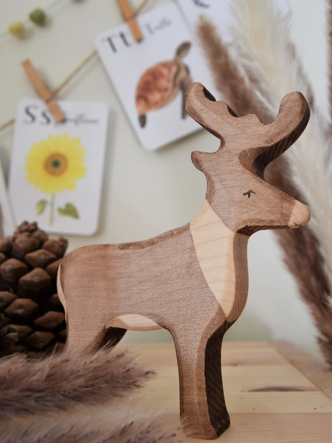 wooden toy reindeer on toy shelf