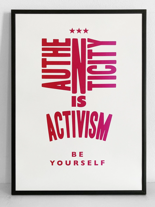 Framed multicoloured typographic print of the quote “Authenticity Is Activism”