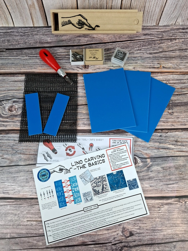 Lino carving and printing kit in wooden box with blue soft lino and versicolor ink pad