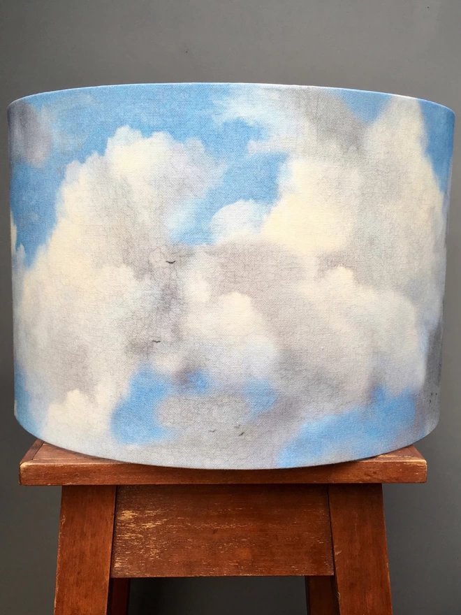 A cloud pattern lampshade with a bright blue sky and white clouds