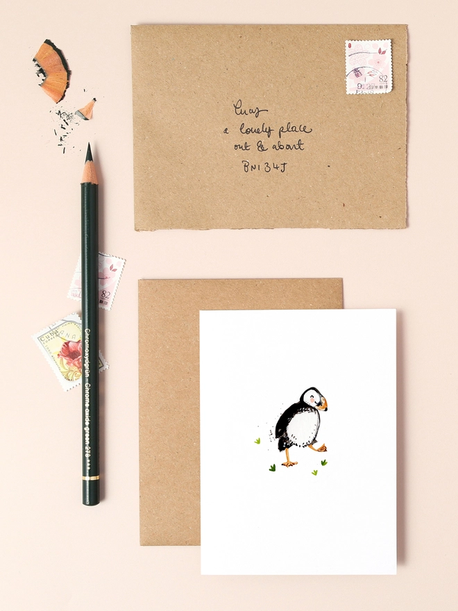 A delightful illustration of a dancing puffin with a joyful expression, exuding a sense of happiness and playfulness. The puffin's distinctive black and white plumage, orange beak, and feet are depicted with soft, flowing lines, capturing its charming character. The minimalist design features a neutral background, allowing the puffin to take centre stage.