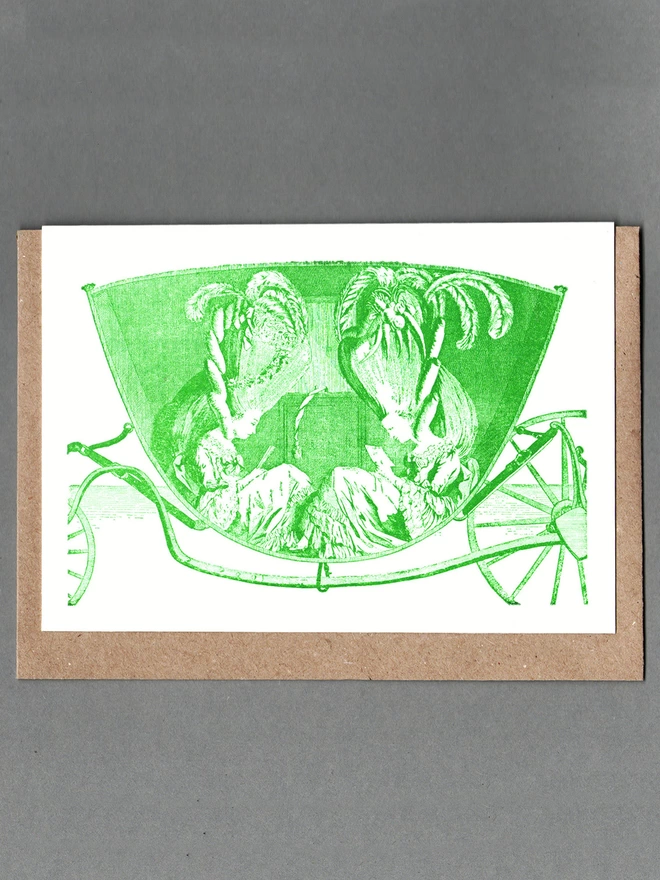 White card with green illustration of two women reading in a carriage with a brown envelope behind