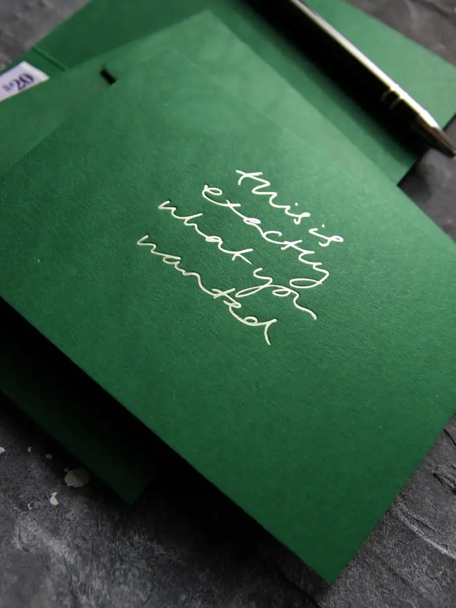 Hand foiled cash card or money wallet in a forest green colour handfoiled in shiny lime green text which says 'this is exactly what you wanted'.