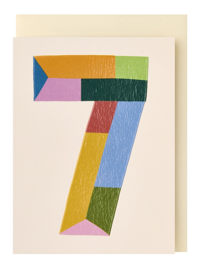 A colourful mini greeting card featuring a colour block 7 in the centre with a cream background