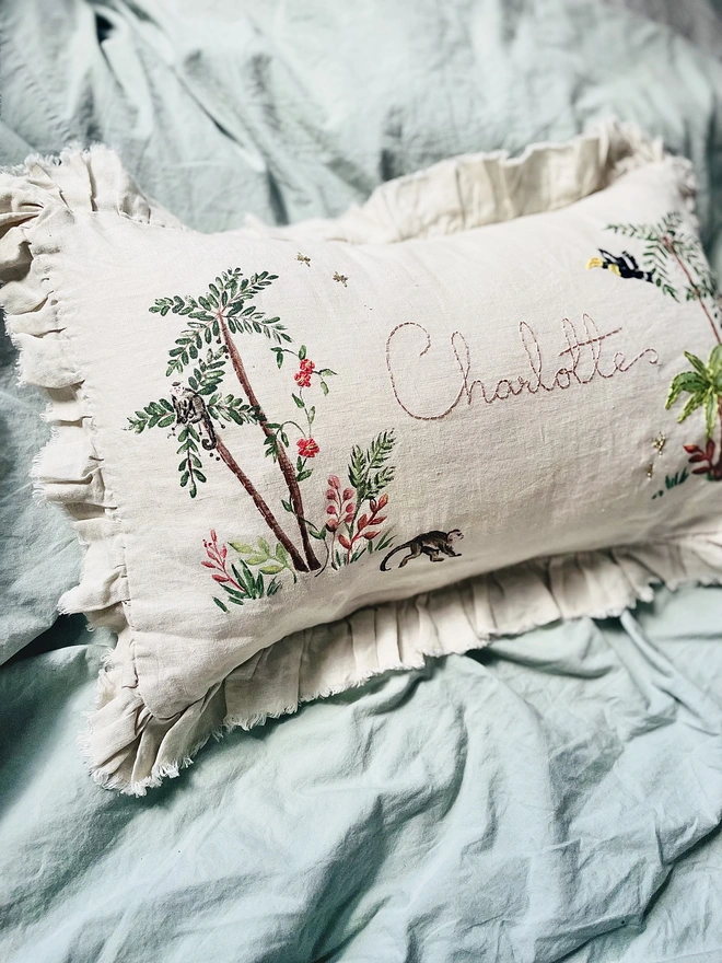 Hand Embroidered Tropical Jungle cushion on natural linen with personalised name 