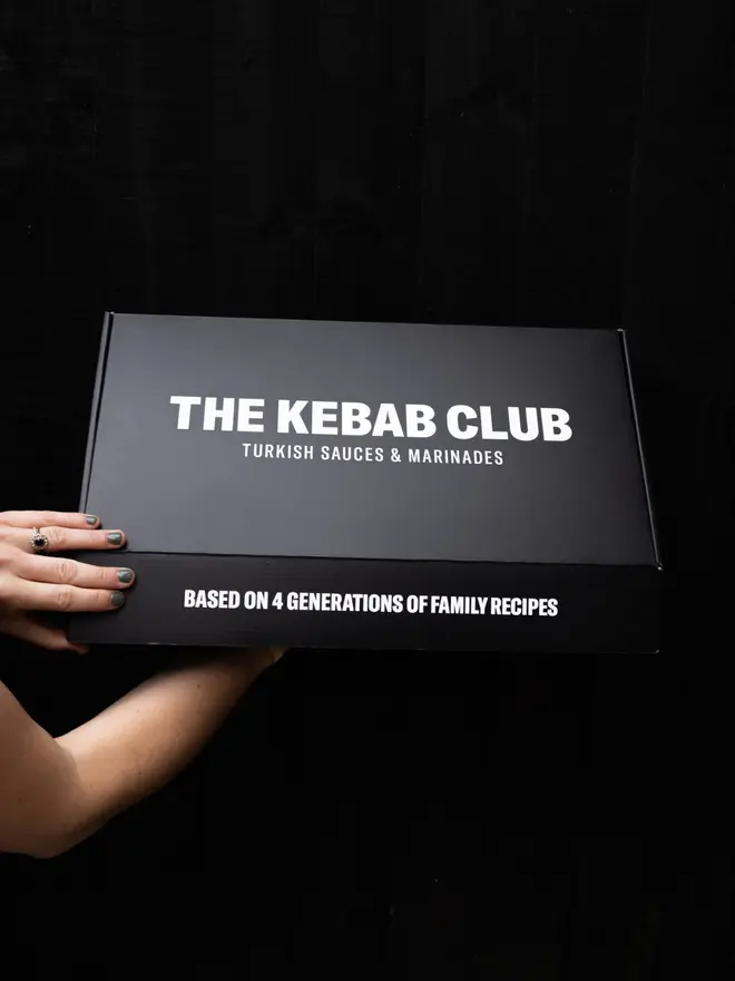 Closed gift box branded with The Kebab Club