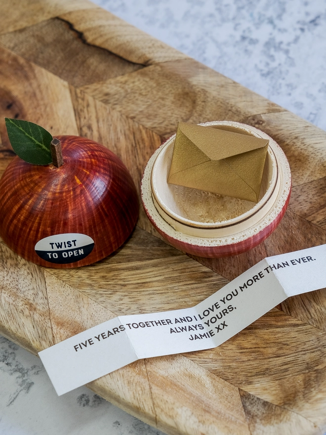 wooden apple with love note