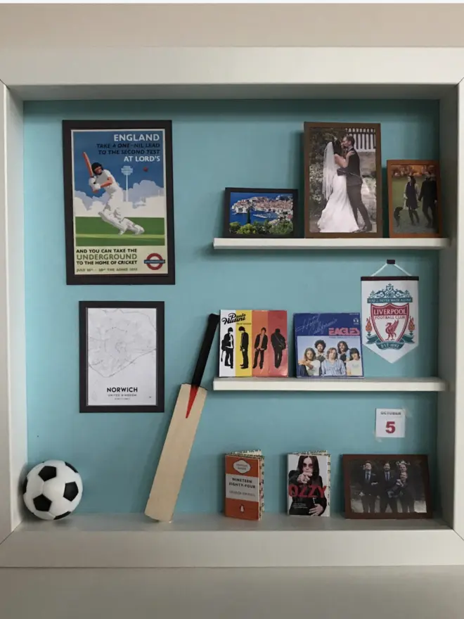 a wooden box with miniatures of the person favourite things inside. Each piece is handmade specially on request. bespoke art piece made by My Papercut Forest