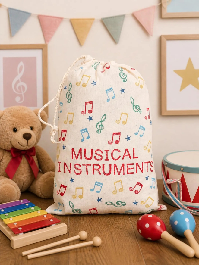 personalised musical bag. a drawstring bag with printed music symbols and a personalised name.