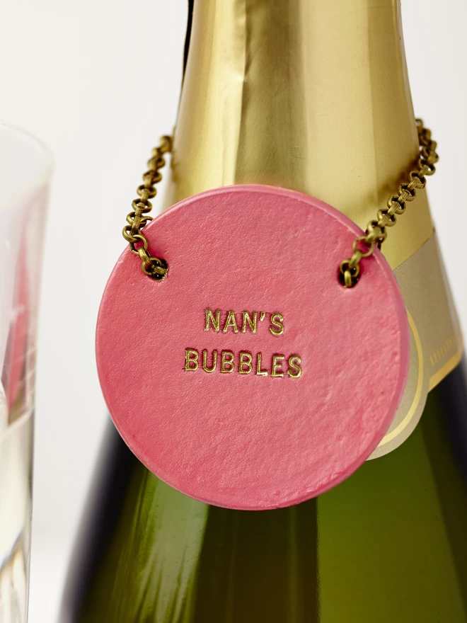 hot pink round leather bottle tag