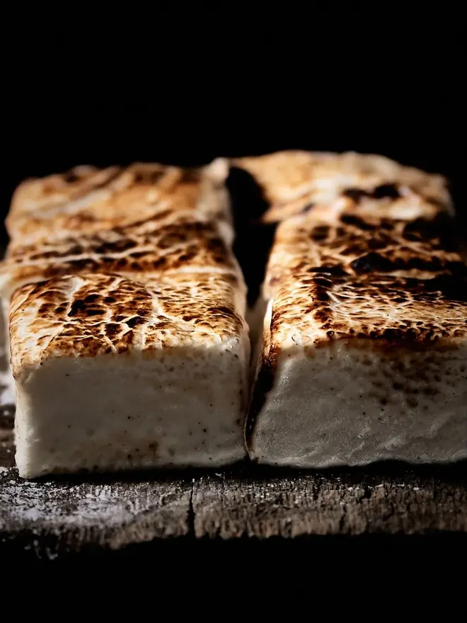 Vanilla Bean Jumbo Mallows (Pack Of 4), four marshmallows with cooked tops. 