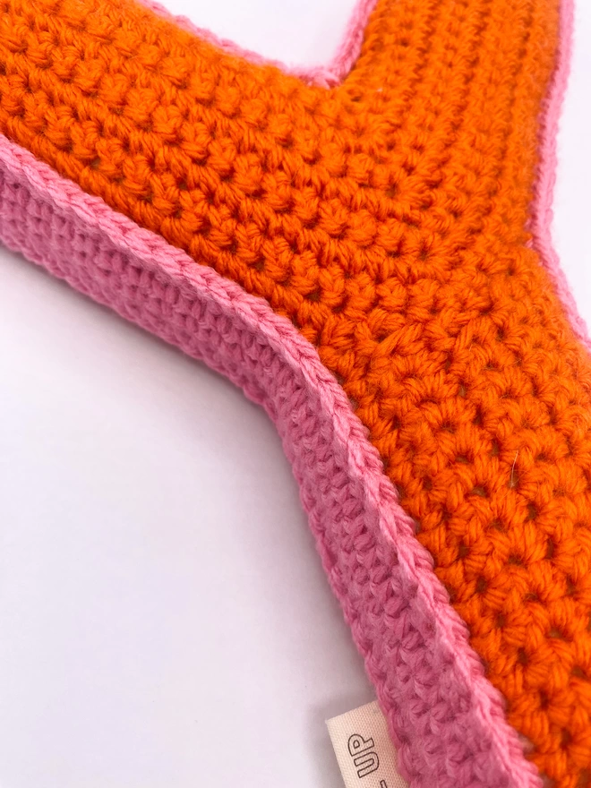 Crochet Y Cushion in Orange and Bubblegum Pink, detail