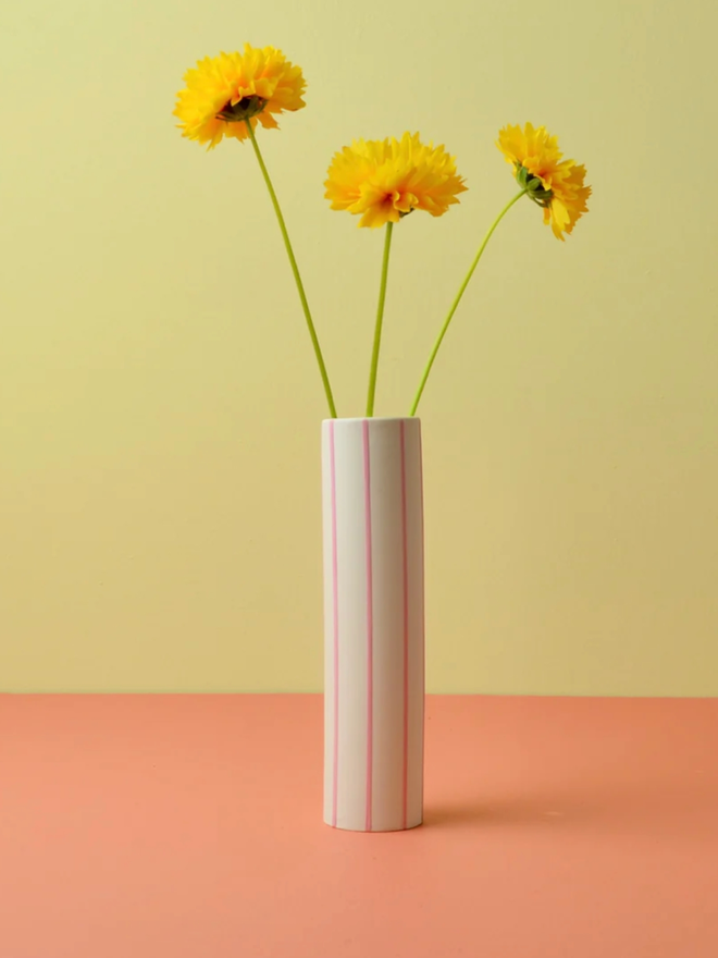 Striped Vase. A yellow and pink striped vase.