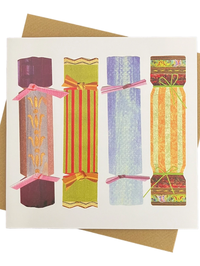Christmas card featuring 4 collage crackers with a brown envelope on a white background