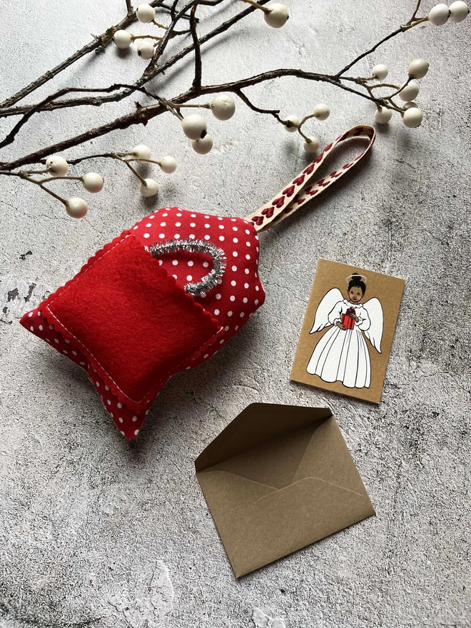 a tiny greeting card featuring an illustration of a little indian angel