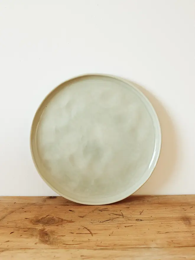 large stoneware plates (set of 2). a large round plate in sea green.