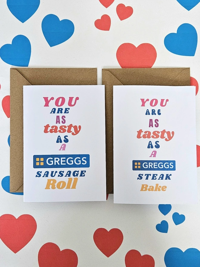 A choice of two humorous valentine greeting card that says you are as tasty as a Greggs Sausage Roll or a Greggs Steak Bake in colourful text in different fonts