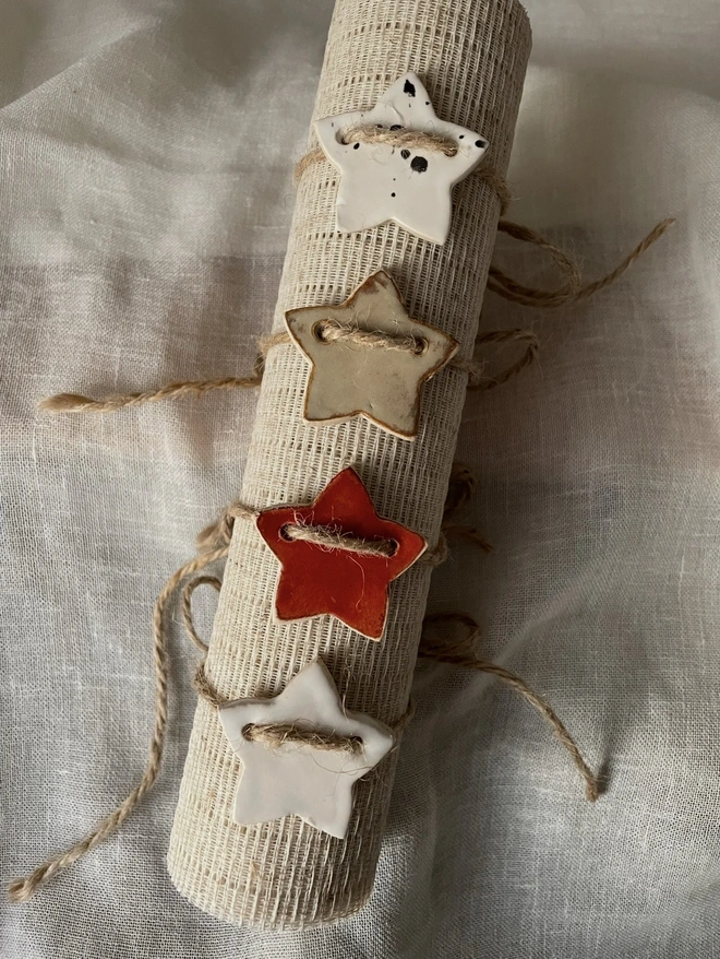 ceramic napkin ring tied round a wodden plank