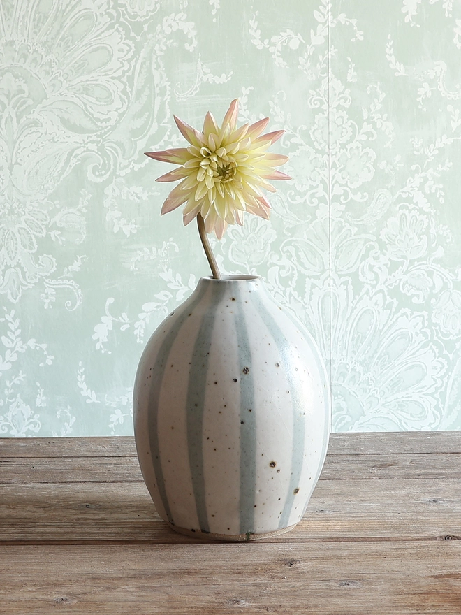  Handmade Ceramic Stoneware Vases in Blue and White Stipe in three different sizes: Small, medium and large. The vases sit on a wooden surface. 