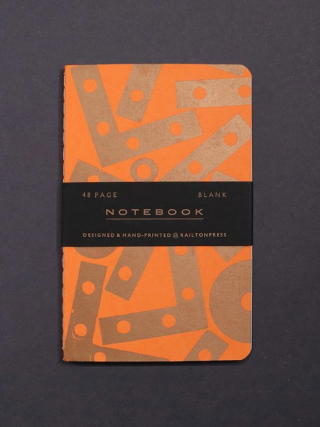 Blank Angle Notebook. A notebook in orange