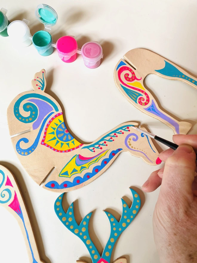 colourful Christmas decorated leather reindeer hand painted