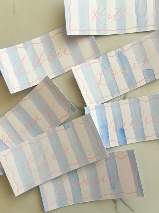 Personalised calligraphy event place cards, blue striped coloured place cards with pink calligraphy name