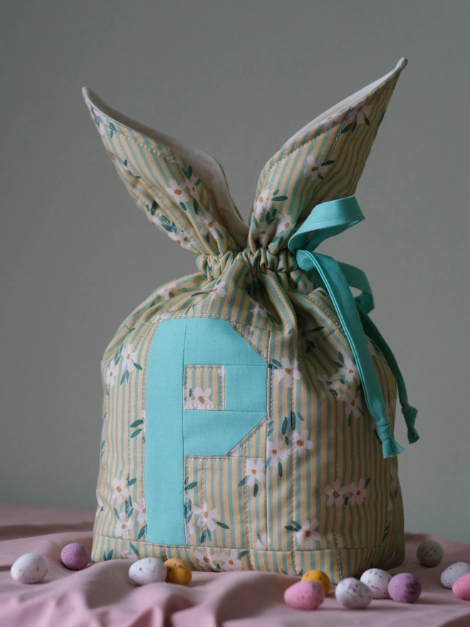 Cooper and Fred personalised easter bunny bag in daisy stripe print with aqua letter