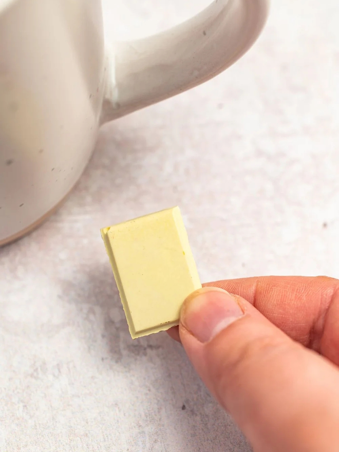 ceramic chocolate magets. a white chocolate magnet photographed up close.