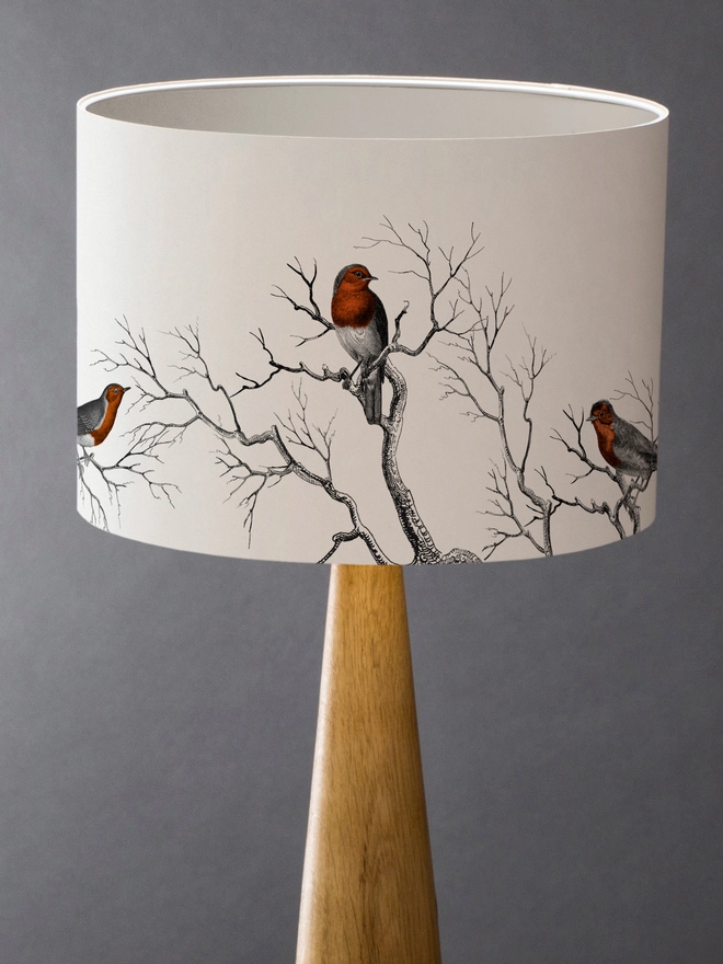 Drum Lampshade featuring Robins with a white inner on a wooden base 