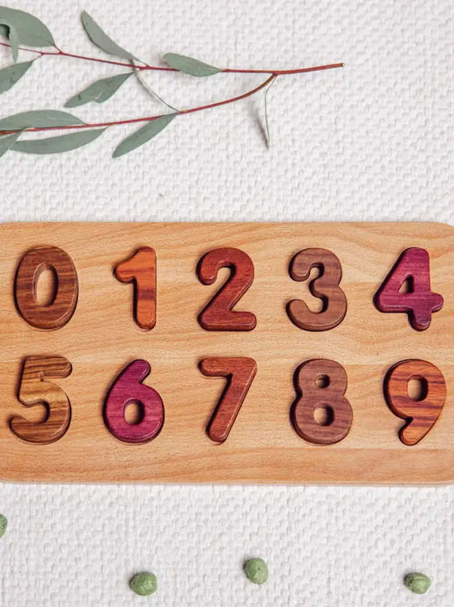 Wooden Number Puzzle Heirloom Toy, on a table. 