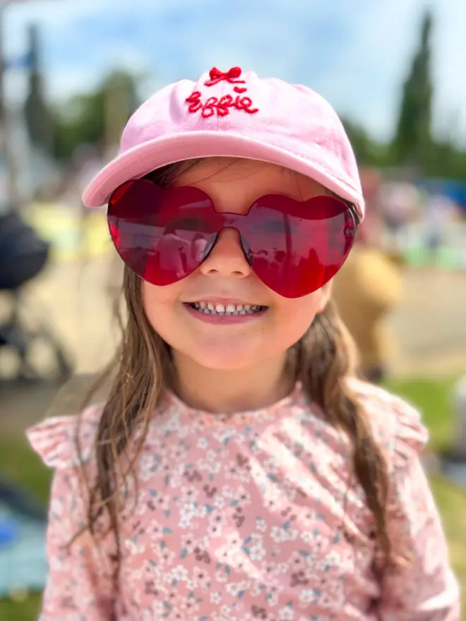 Girl wearing hand-embroidered cap
