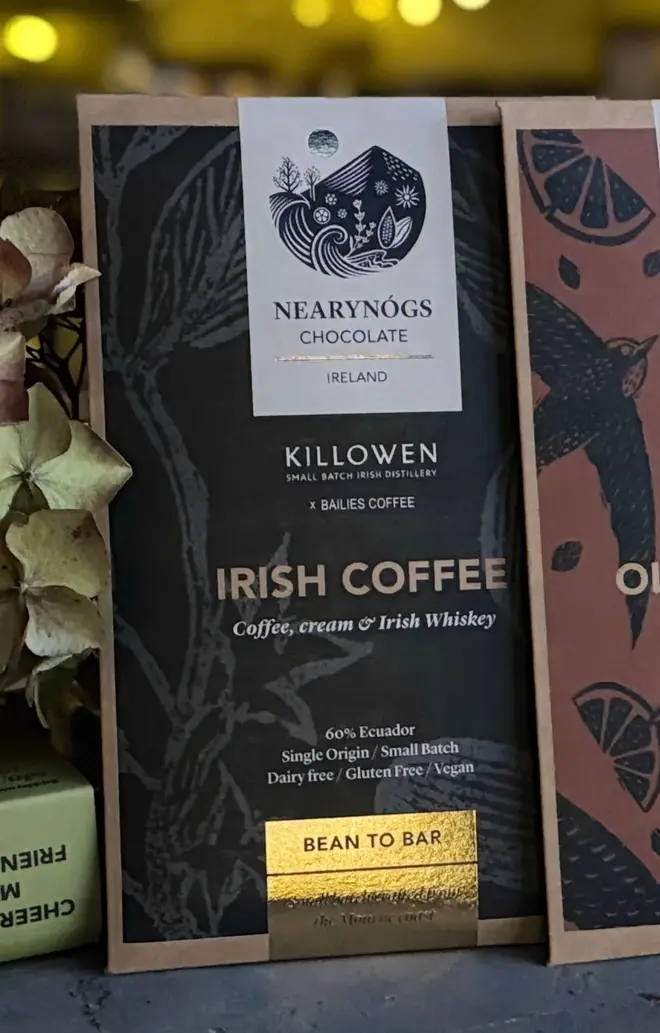 Irish Coffee Bar, a chocolate bar sitting in a group of chocolate bars on a stone surface.  