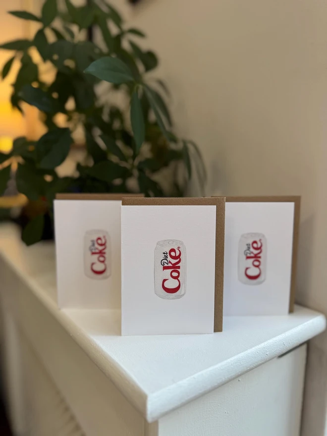 diet coke can illustrated mini cards (pack of 3). card set photographed on mantelpiece.