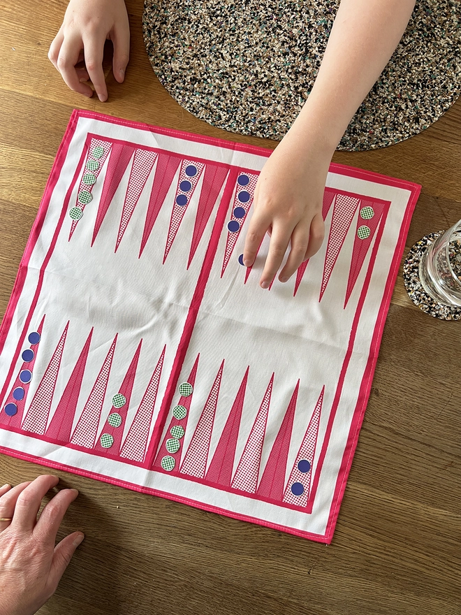 Mr.PS Backgammon Napkin in play using the cut out counters