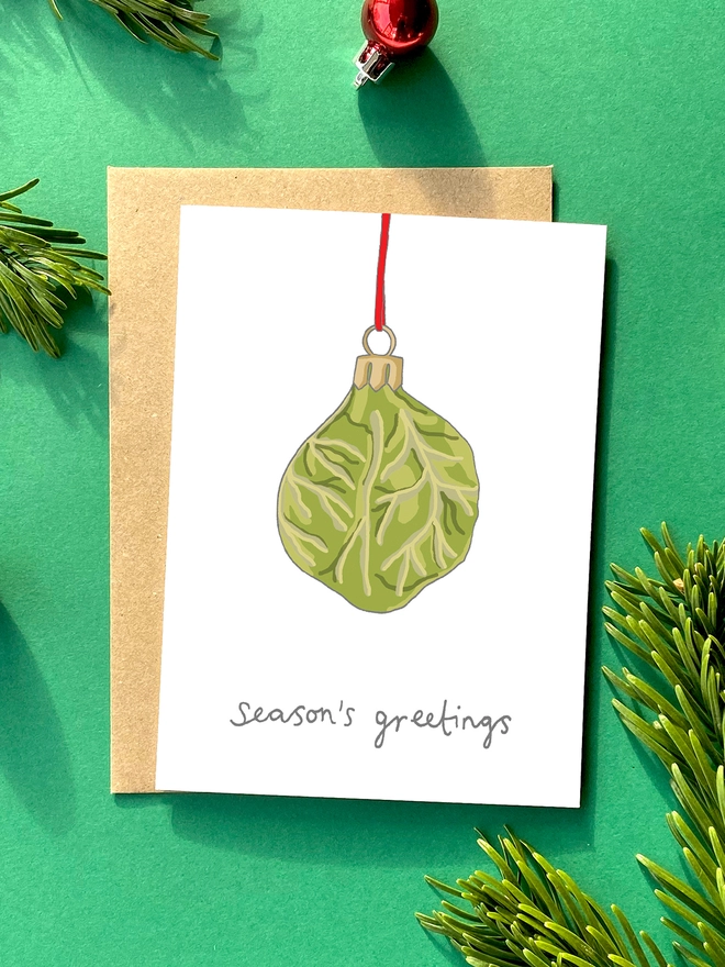 Festive Christmas card featuring a kitsch Christmas decoration