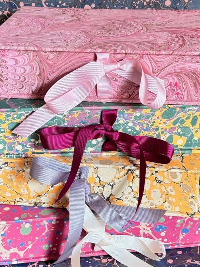 A4 Keepsake Box. A stack of boxes tied with ribbons.