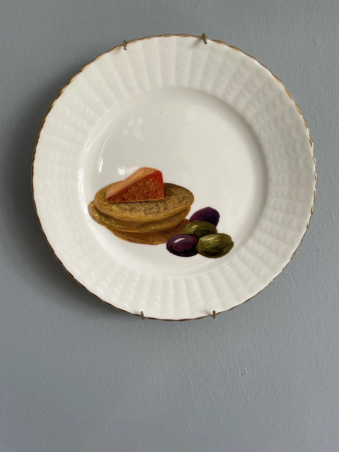 cheese and cracker painting on plate